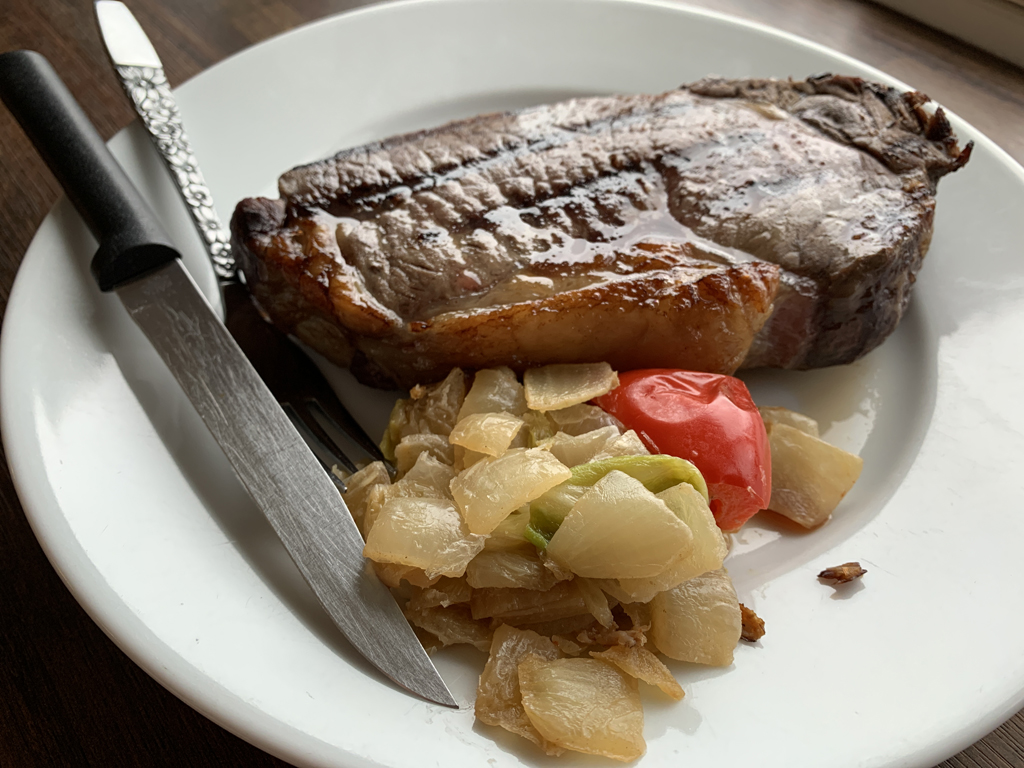 reverse-seared steak with onions and red pepper